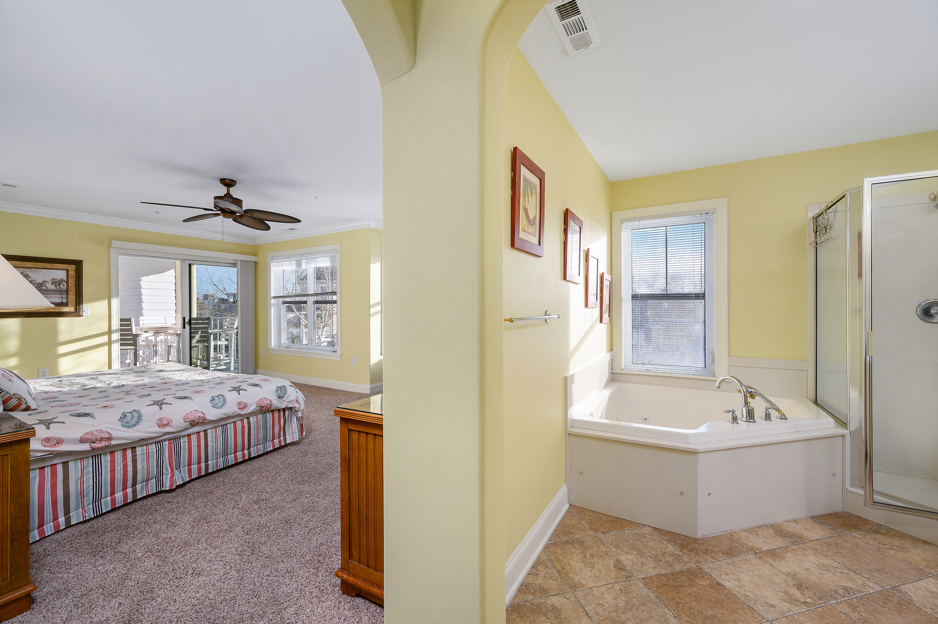 Relax in the corner soaking tub of the en suite Primary Bathroom