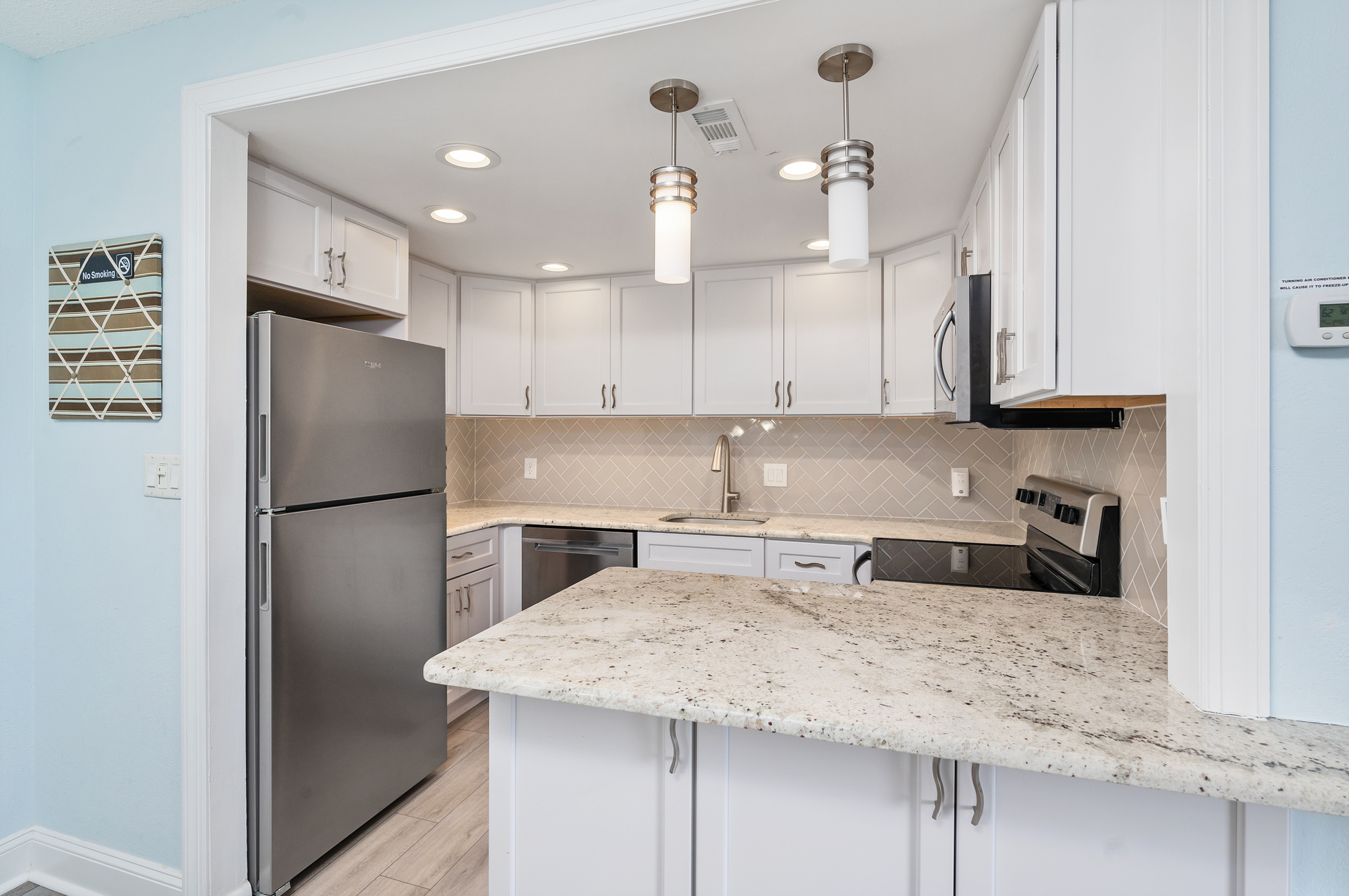The Chef in your family will be in awe of this Gorgeous Kitchen with Beachy White Cabinetry.