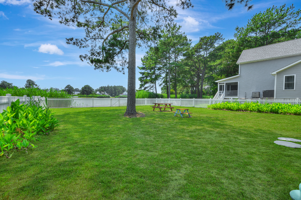 Plenty of space in the fenced in yard for the kids to play
