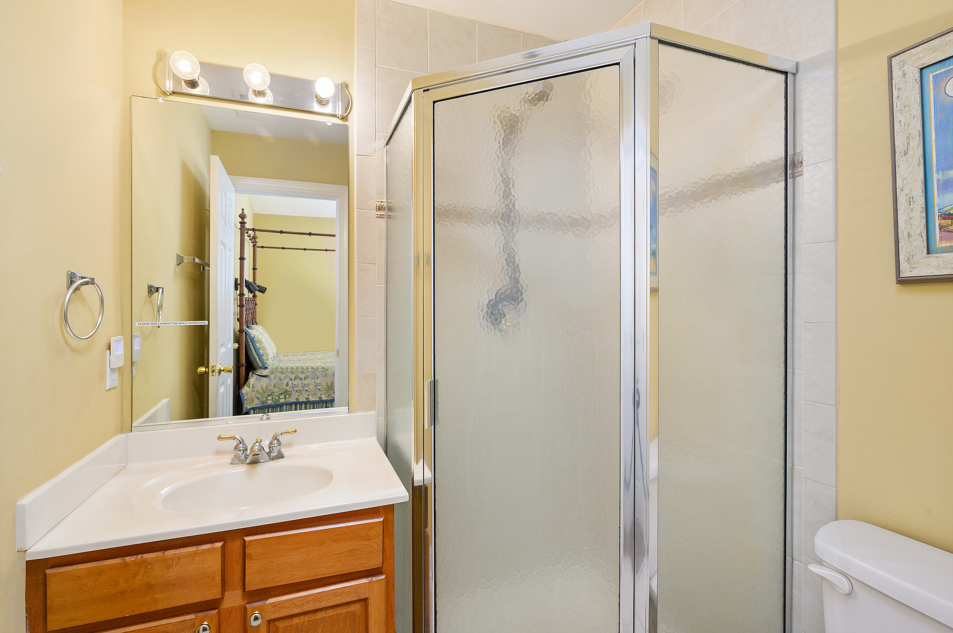 Bedroom 2 is a jr Primary with en suite bathroom, complete with walk-in shower