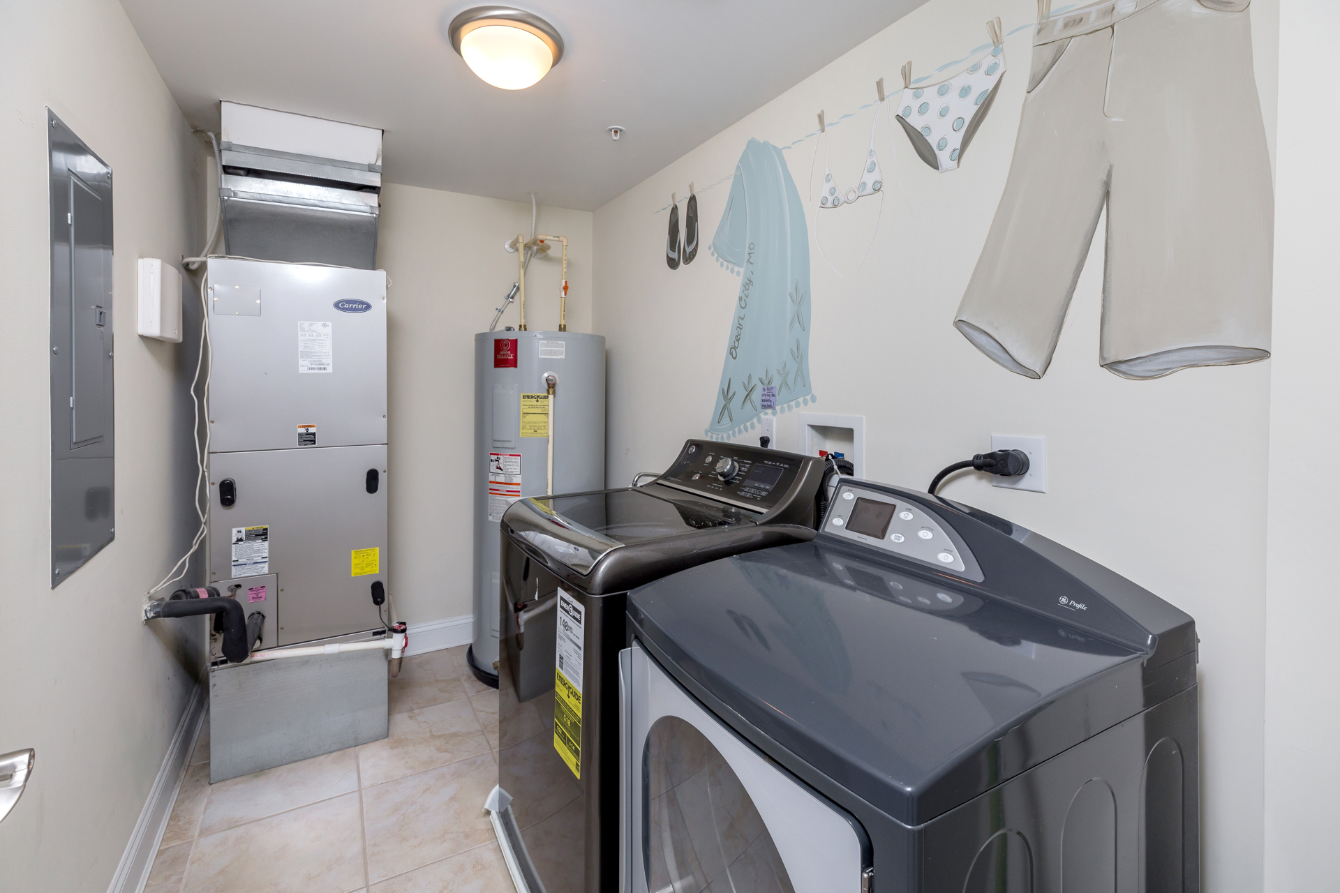 Very cool Laundry Room with Full Size Washer & Dryer and fun Hand-Painted Murals.