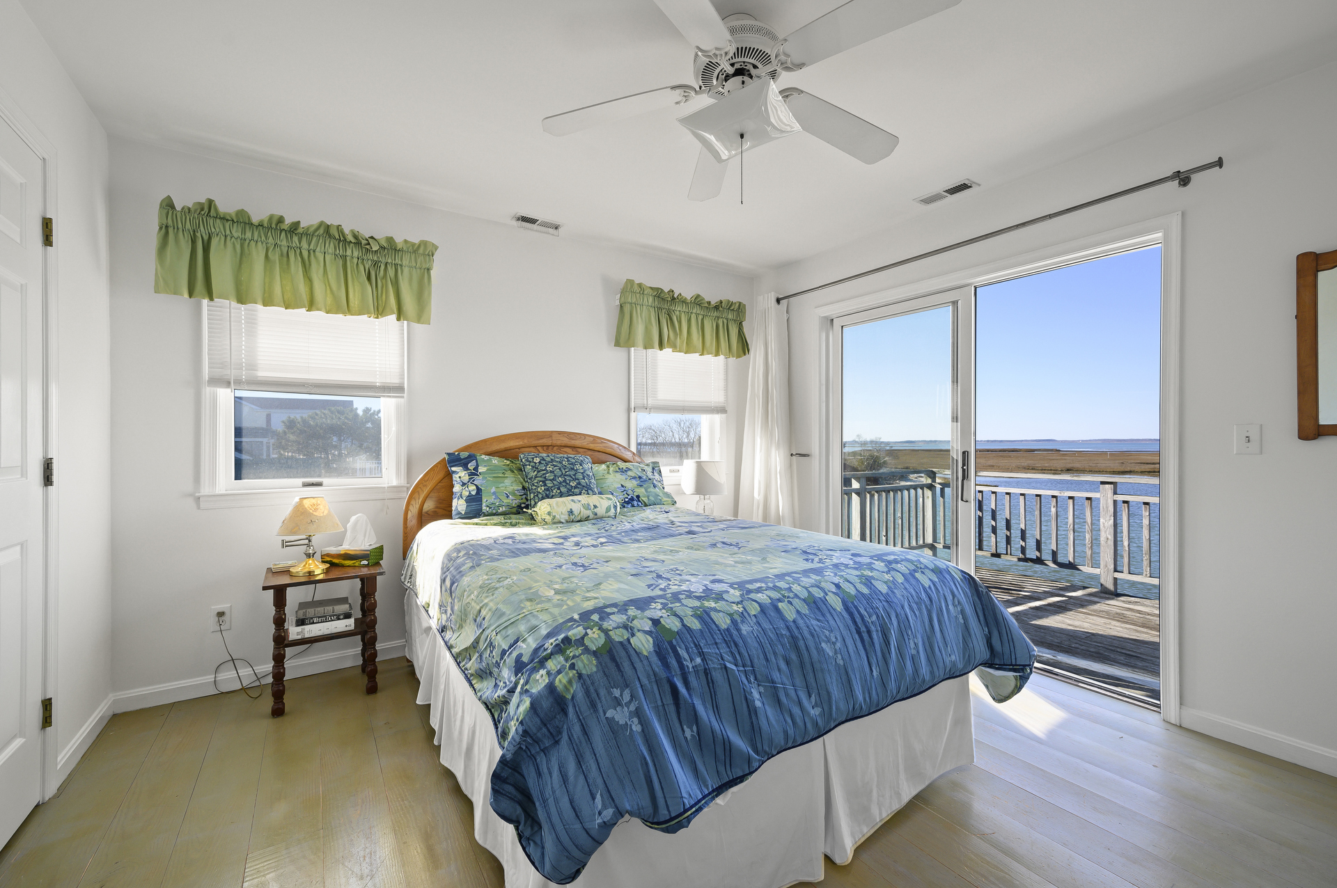 Bedroom 1 has a Queen Bed & Deck Access.