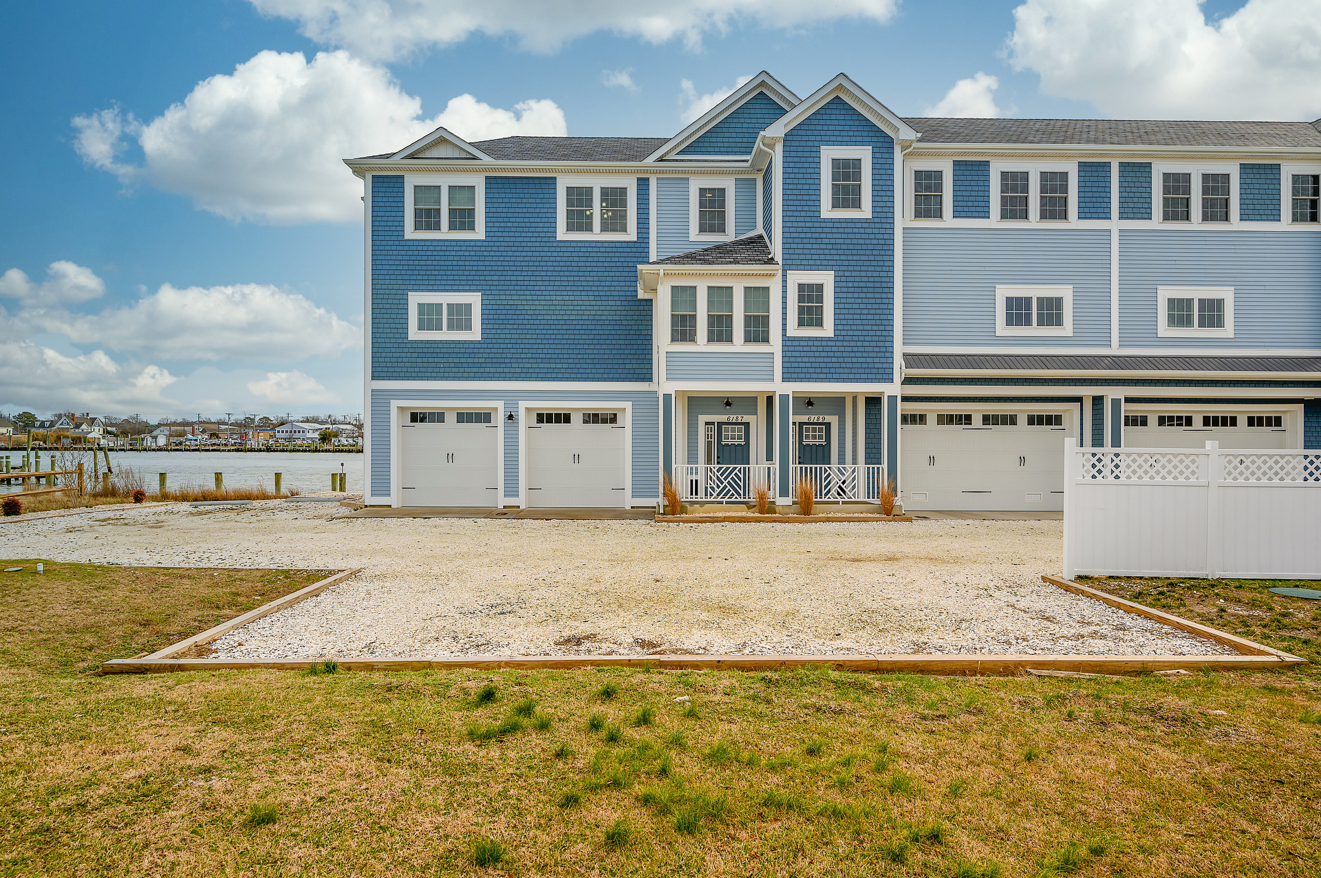 'At the Water's Edge' is the 2nd home from the left.