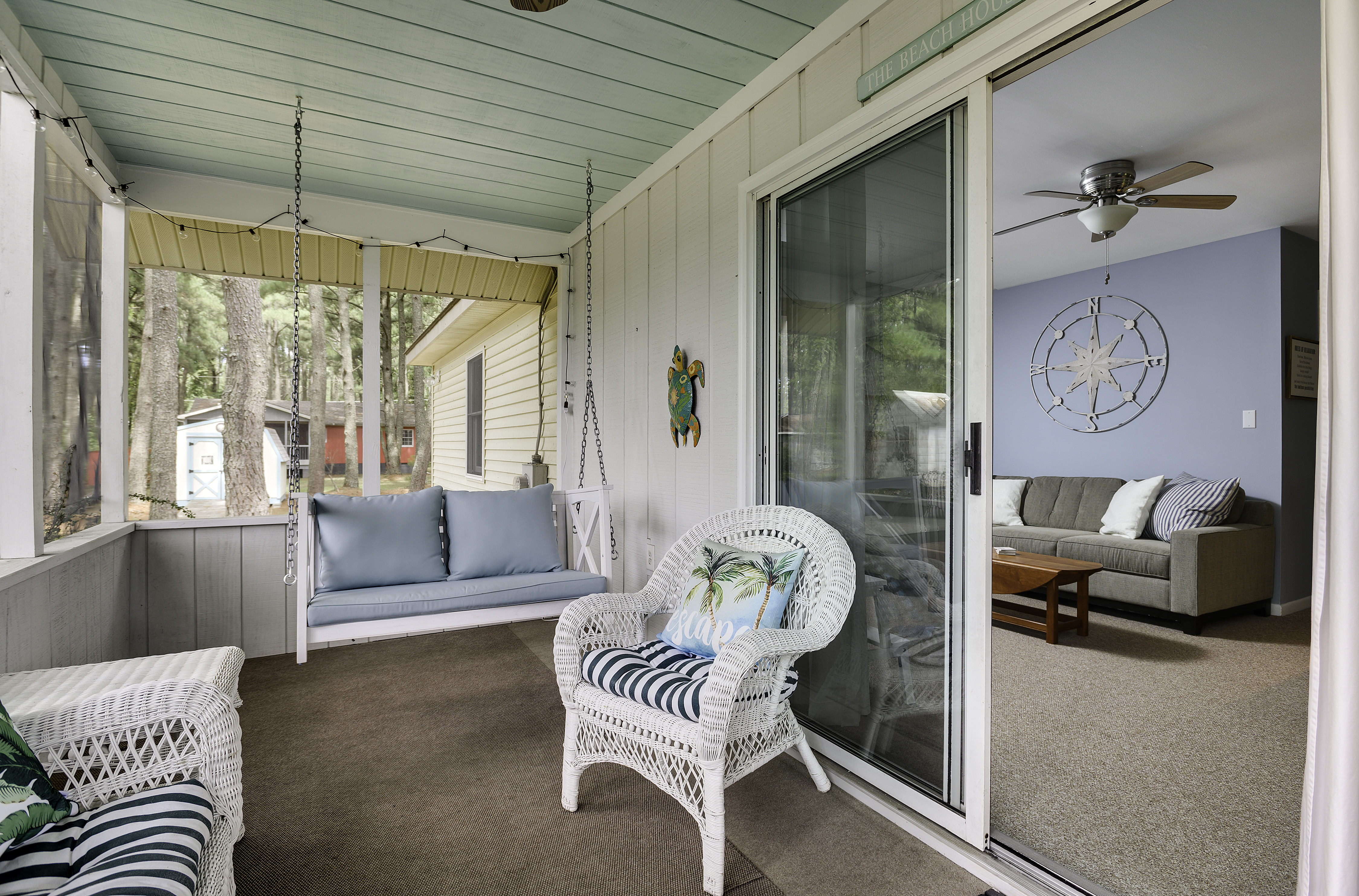 Relax on the swing and listen to the sea breeze whisper through the Pines.