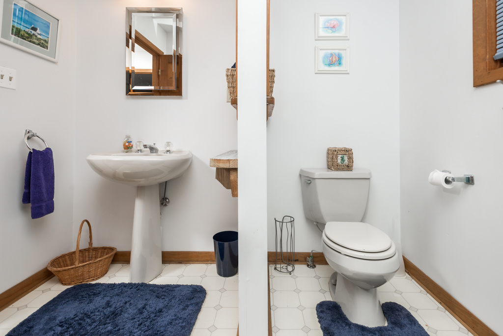 Nautically themed Full Bathroom with privacy barrier.