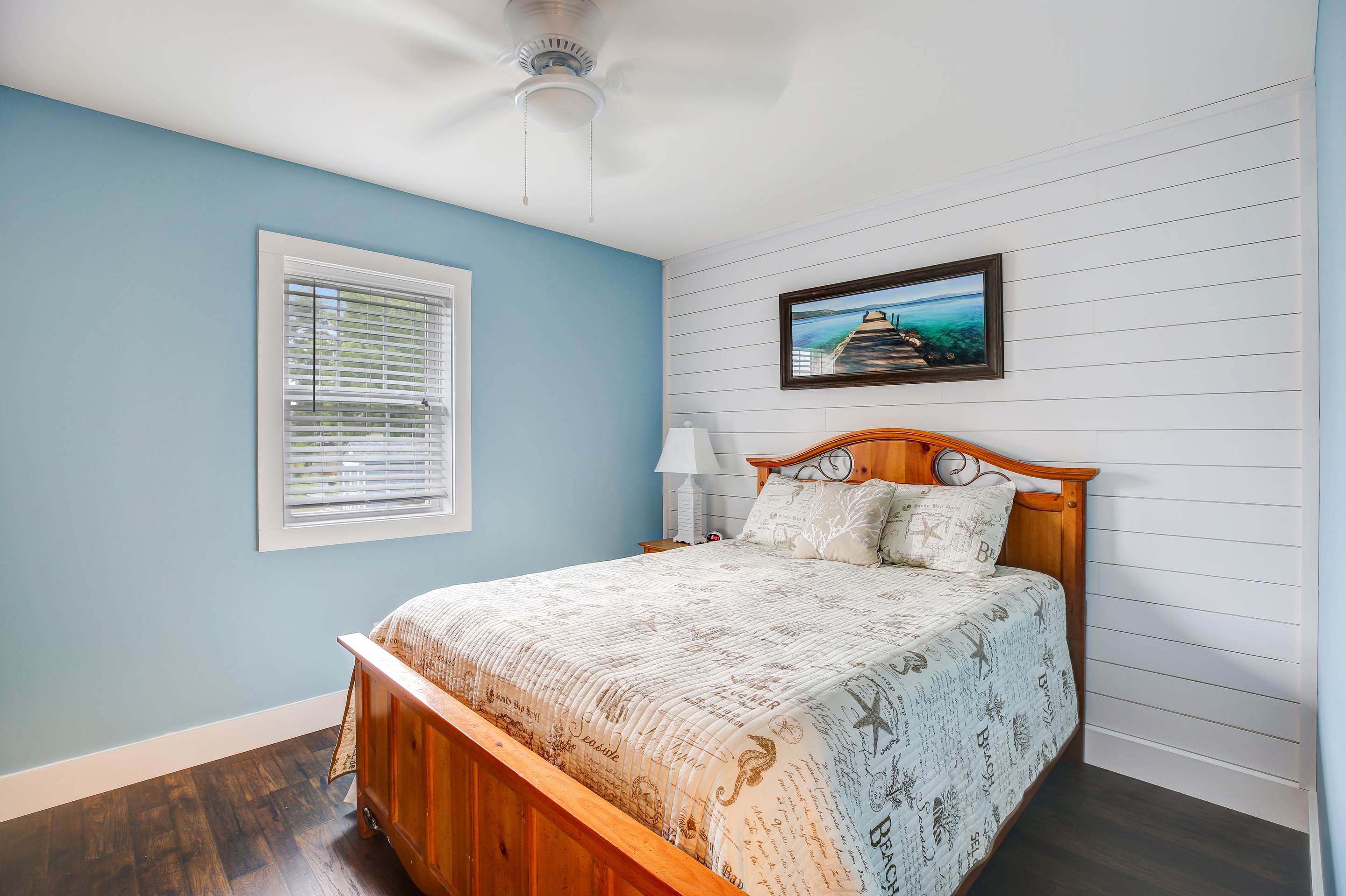 Bedroom 1 is on the 1st Floor with a Queen Bed and Flat Screen TV.