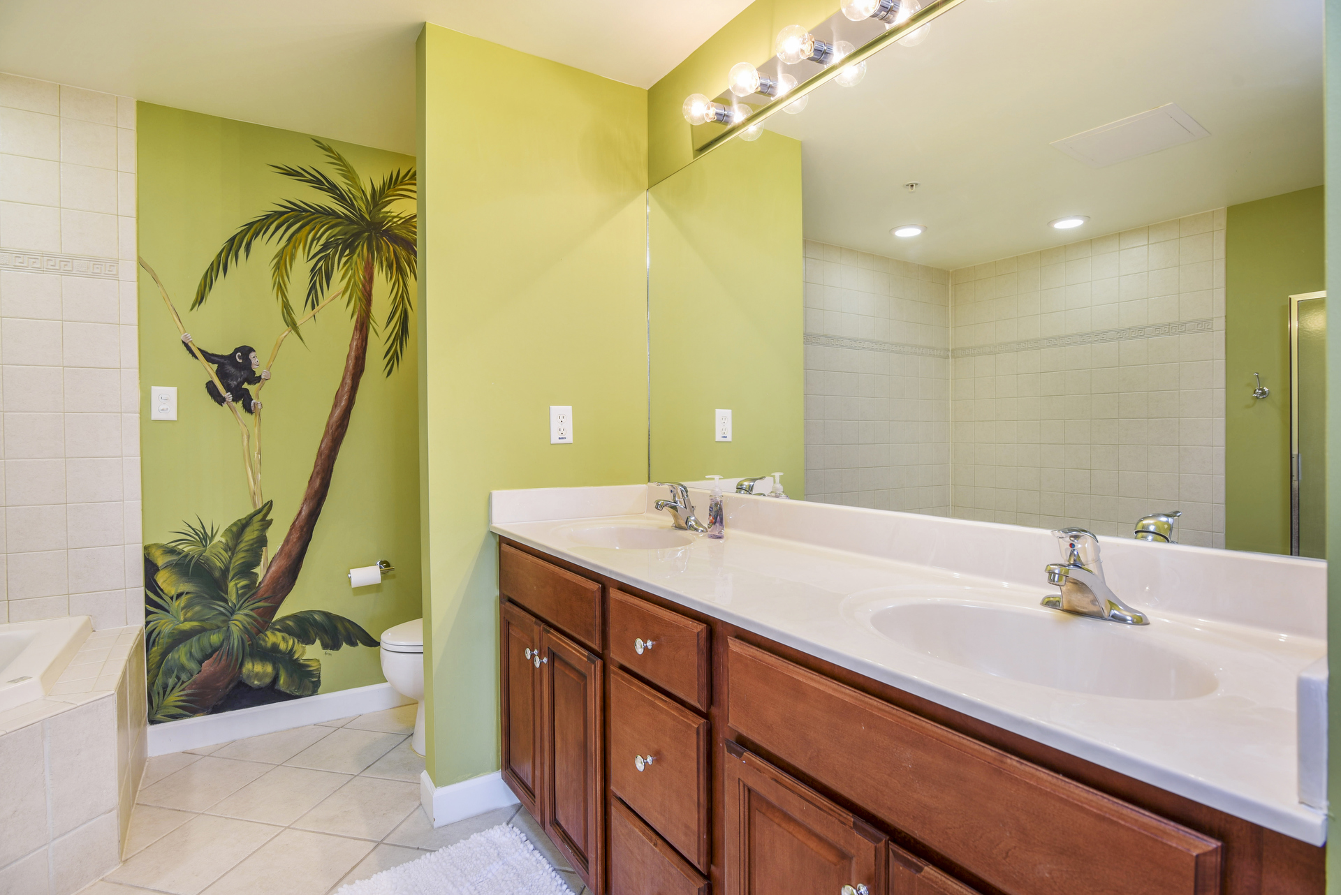 You just might feel like you`re in Paradise in the Tropical Themed Primary Bath.