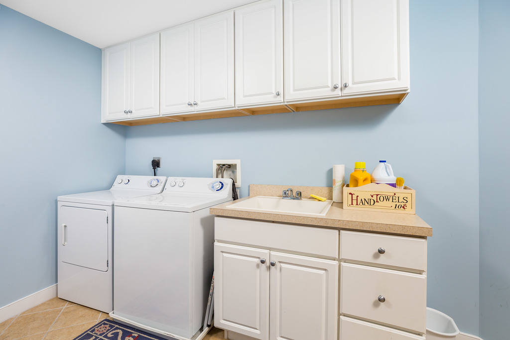 Deluxe Laundry Room with sink and work area.