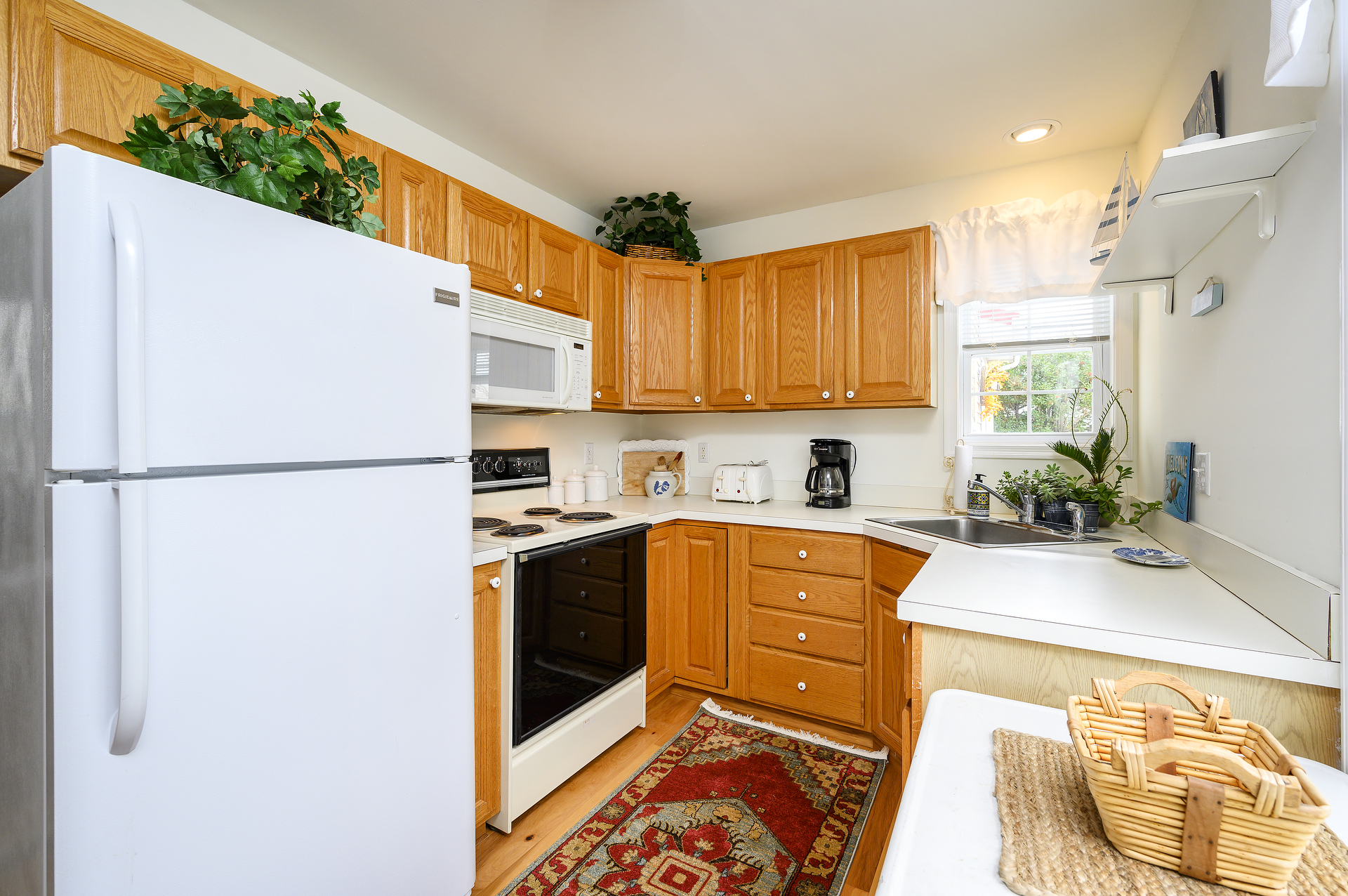 Brand New Floors in the Well-Stocked Kitchen.