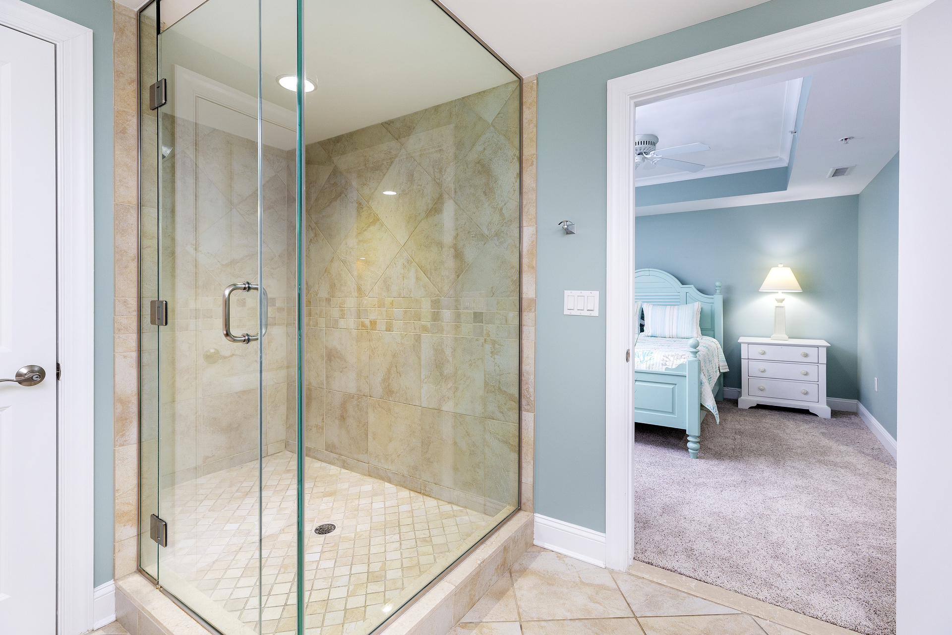 There is also a Glass Walk-in Shower with Custom Tile in the Primary.