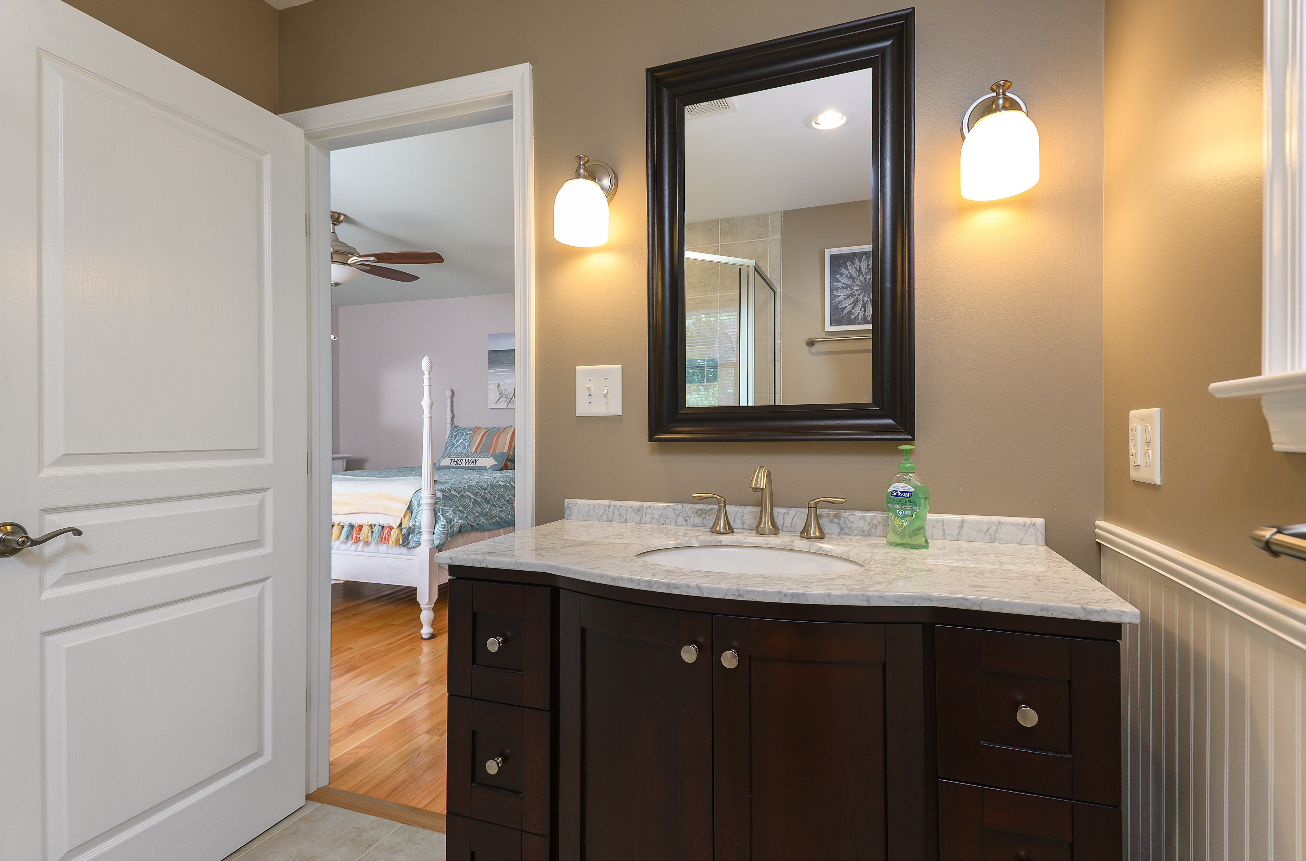 The Master Bath is a work of Art itself with lovely Granite Vanity & tasteful decor.