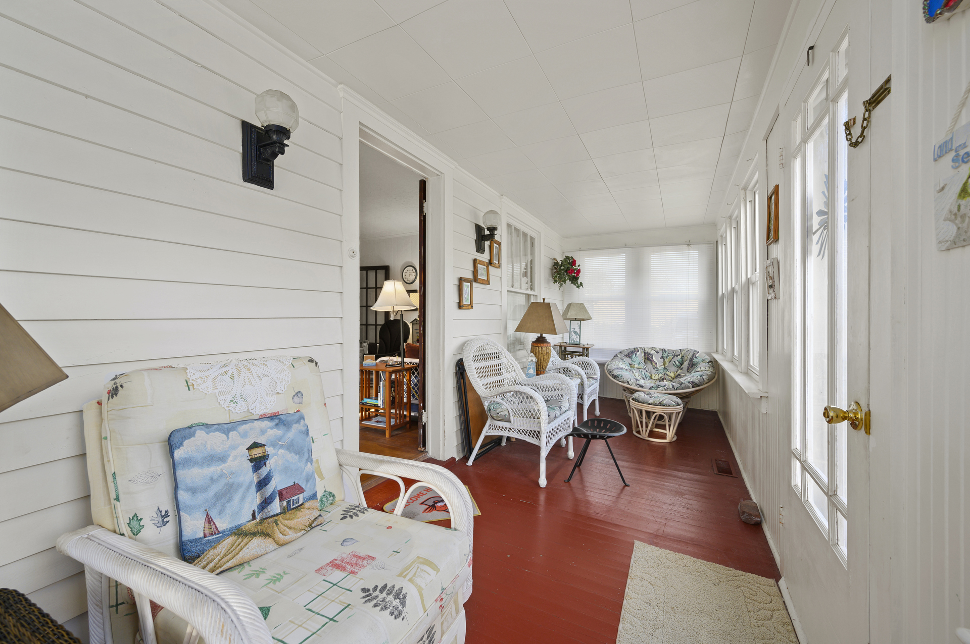 A charming Enclosed Front Porch lines the front of Breezy Corner.