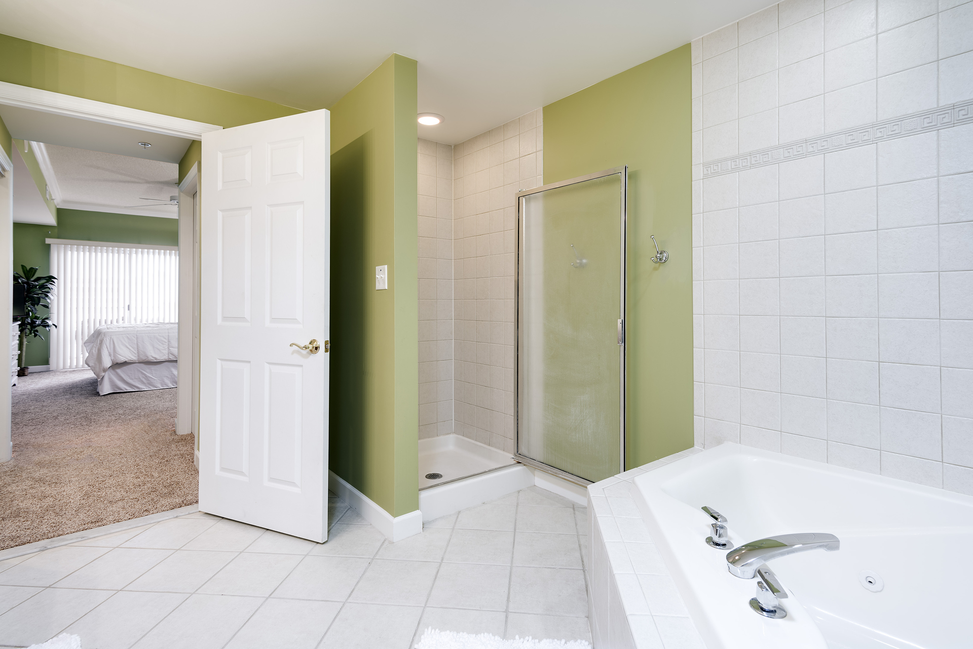 You just might feel like you`re in Paradise in the Tropical Themed Primary Bath.