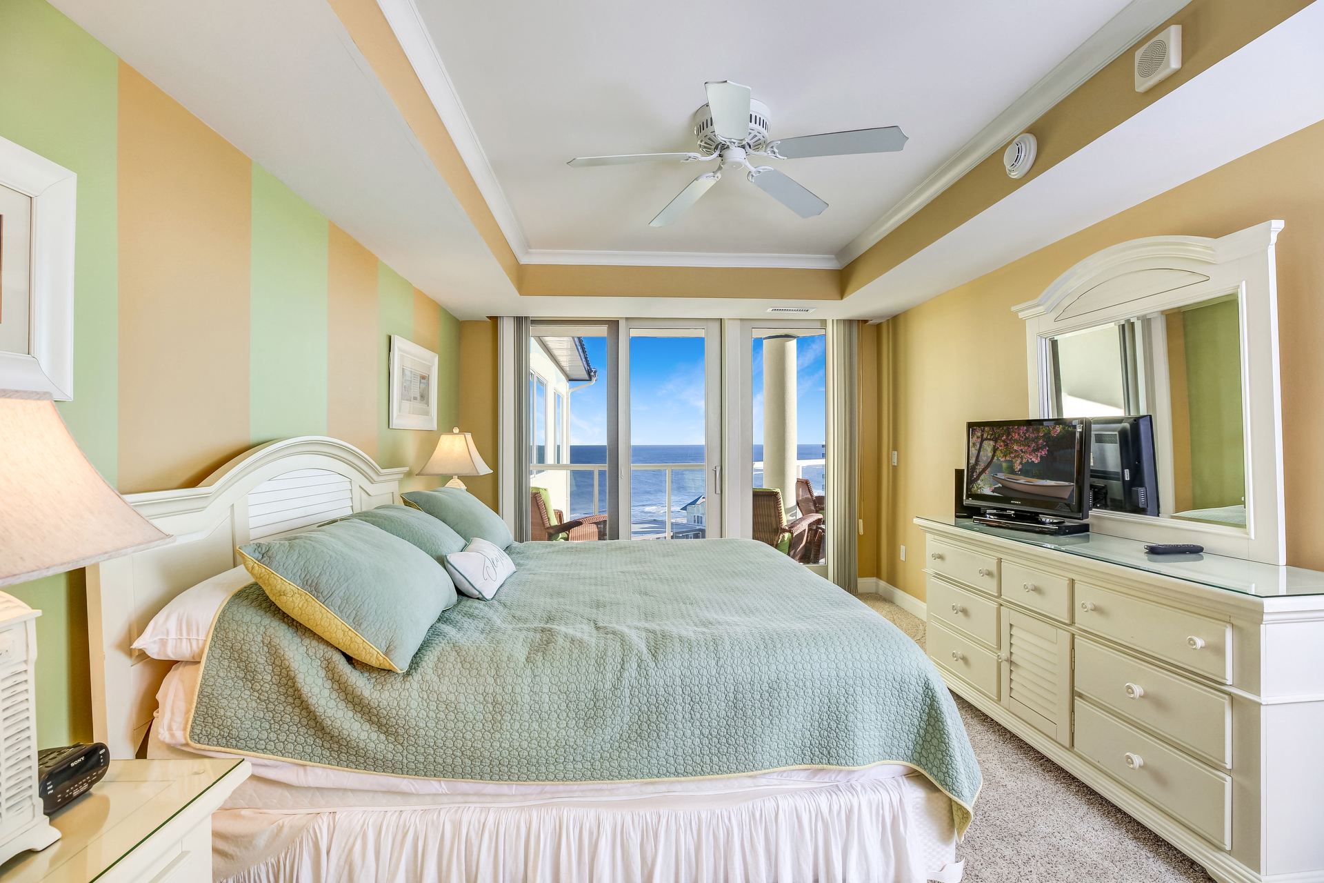 The Primary Bedroom has a comfy King Bed and access to the Ocean View Balcony.