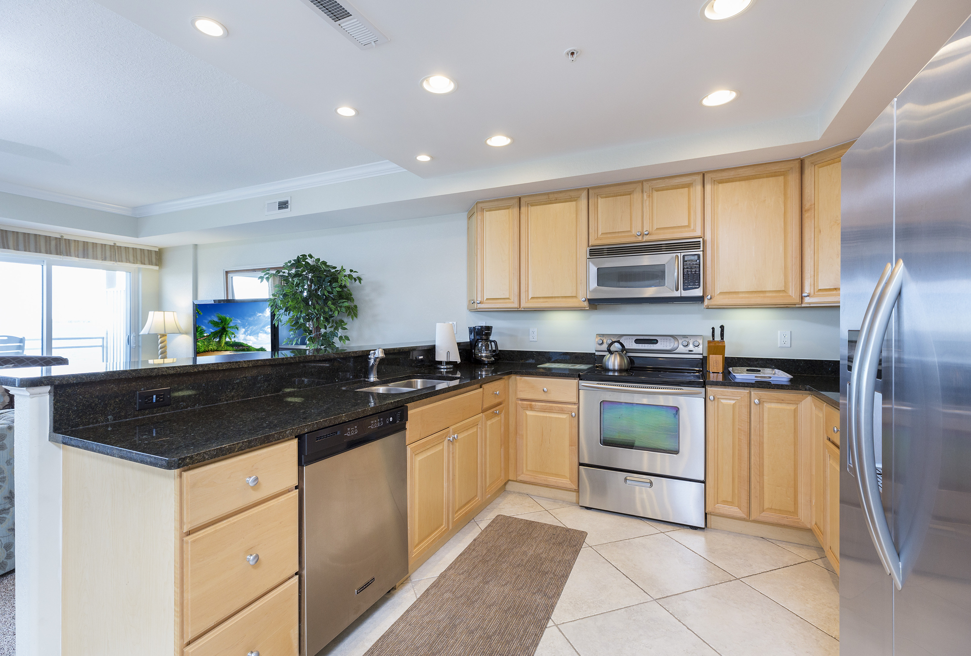 Warm Wood & Custom Tile in this Gourmet Kitchen.