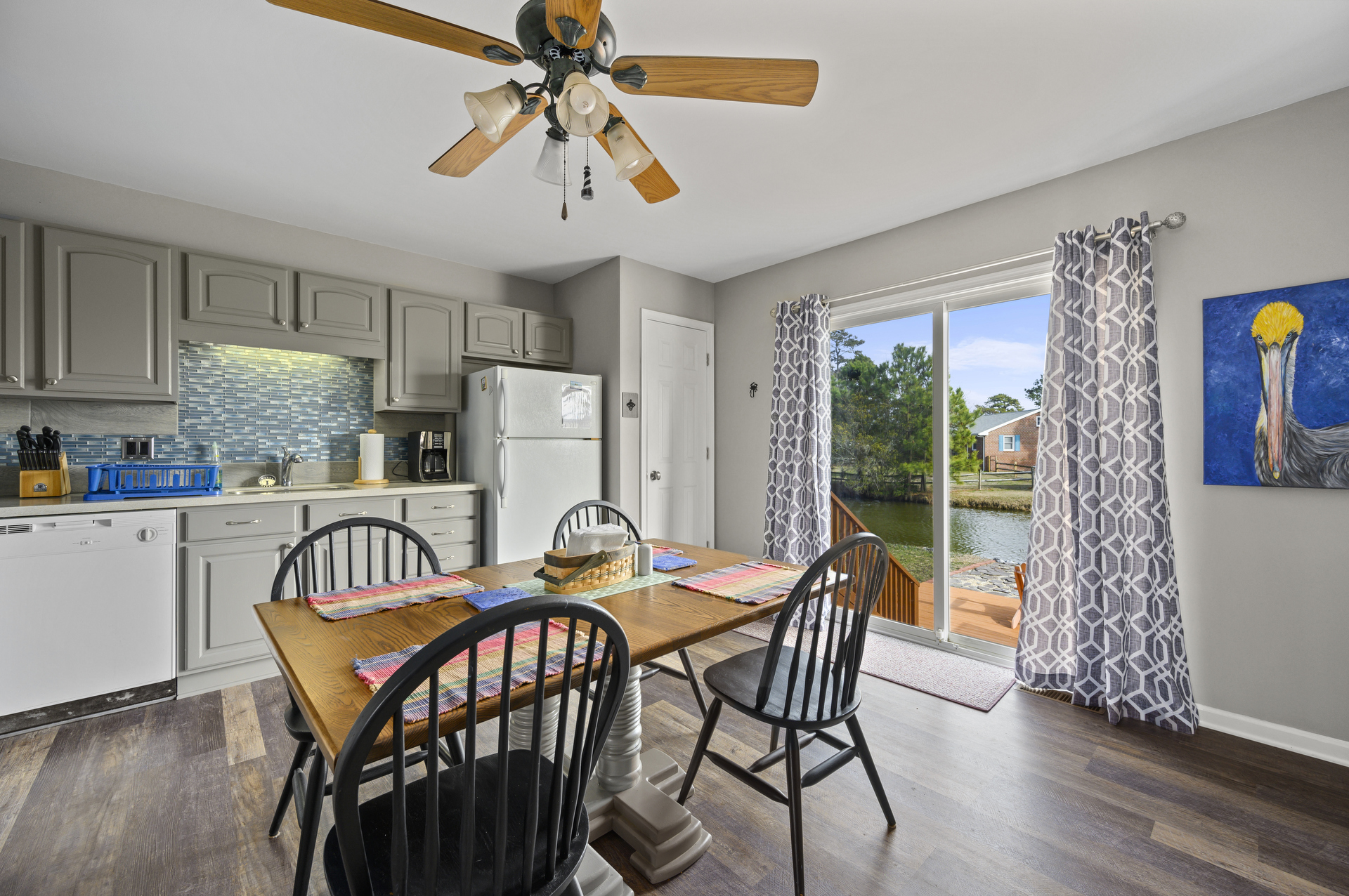 Spacious Eat-in Kitchen leads to Waterfront Patio.