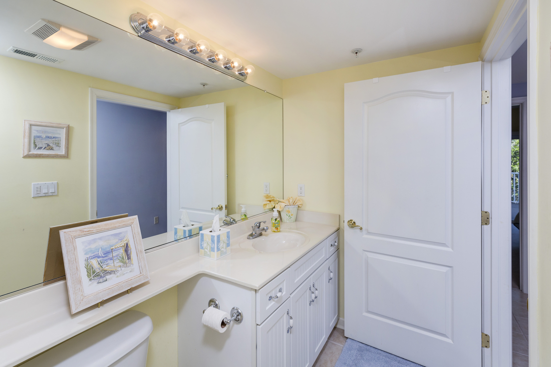 Bright, sunny yellows and blues adorn this cheerful, beachy home.