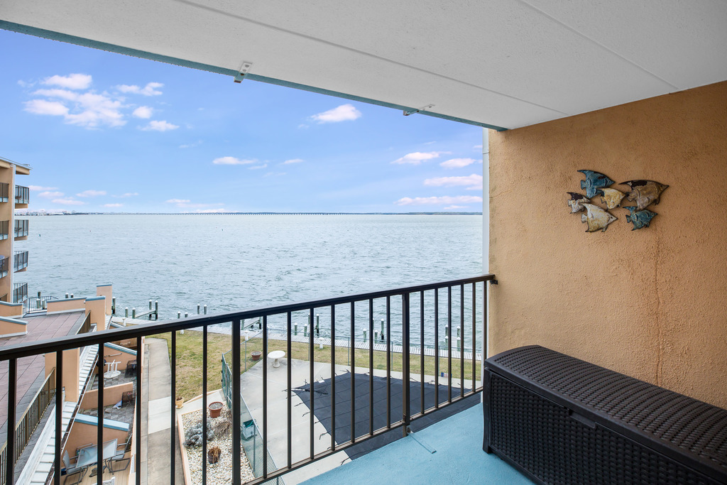 Balcony overlooks refreshing Bayfront Pool.