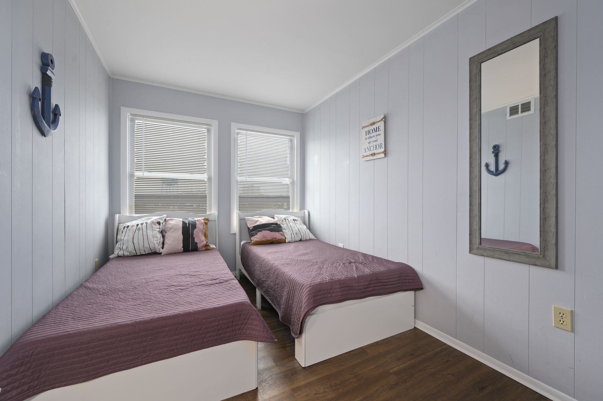 Bedroom 2 has 2 Twin Beds and a fun Nautical Theme.