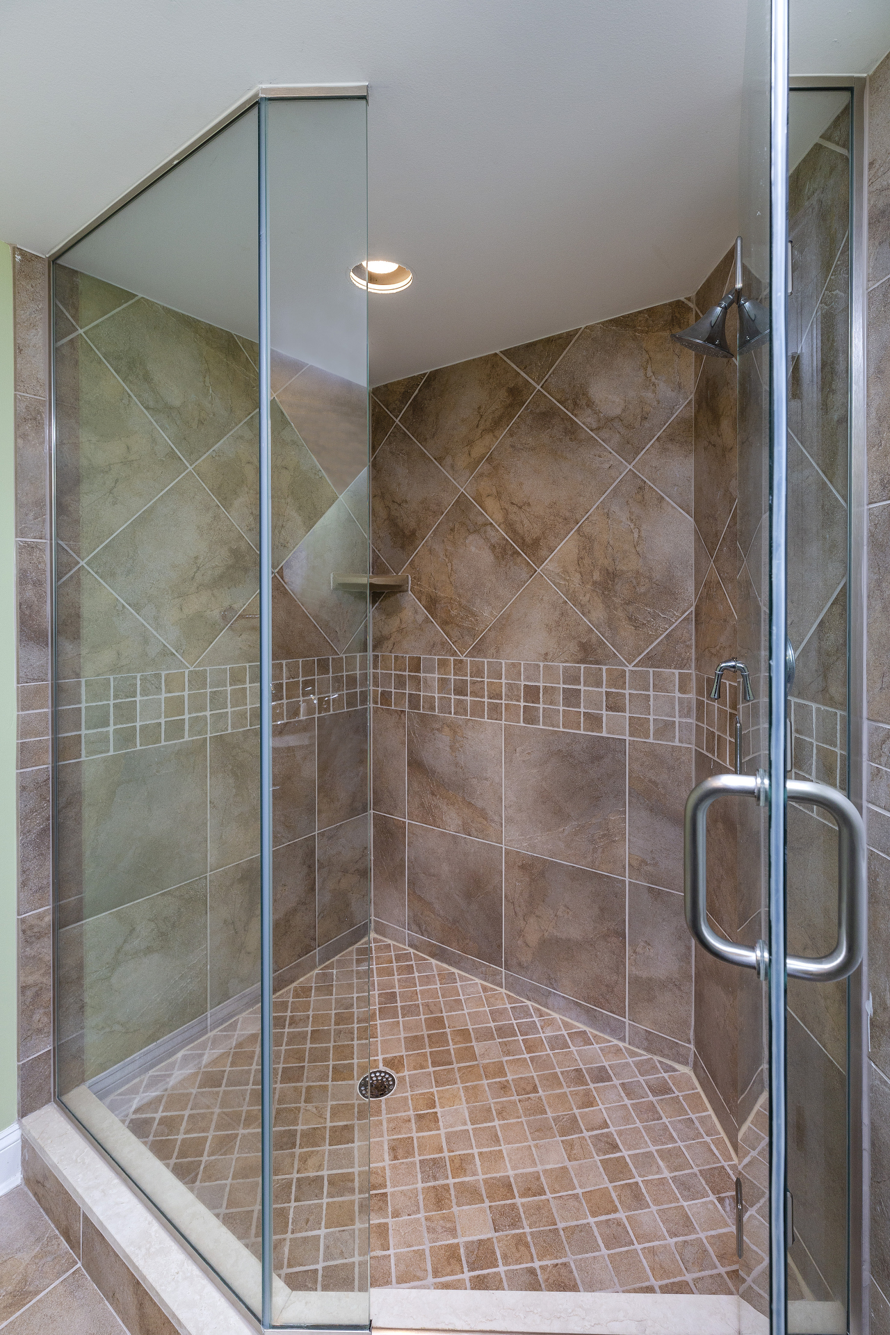 Stunning Glass Shower with Custom Tile.