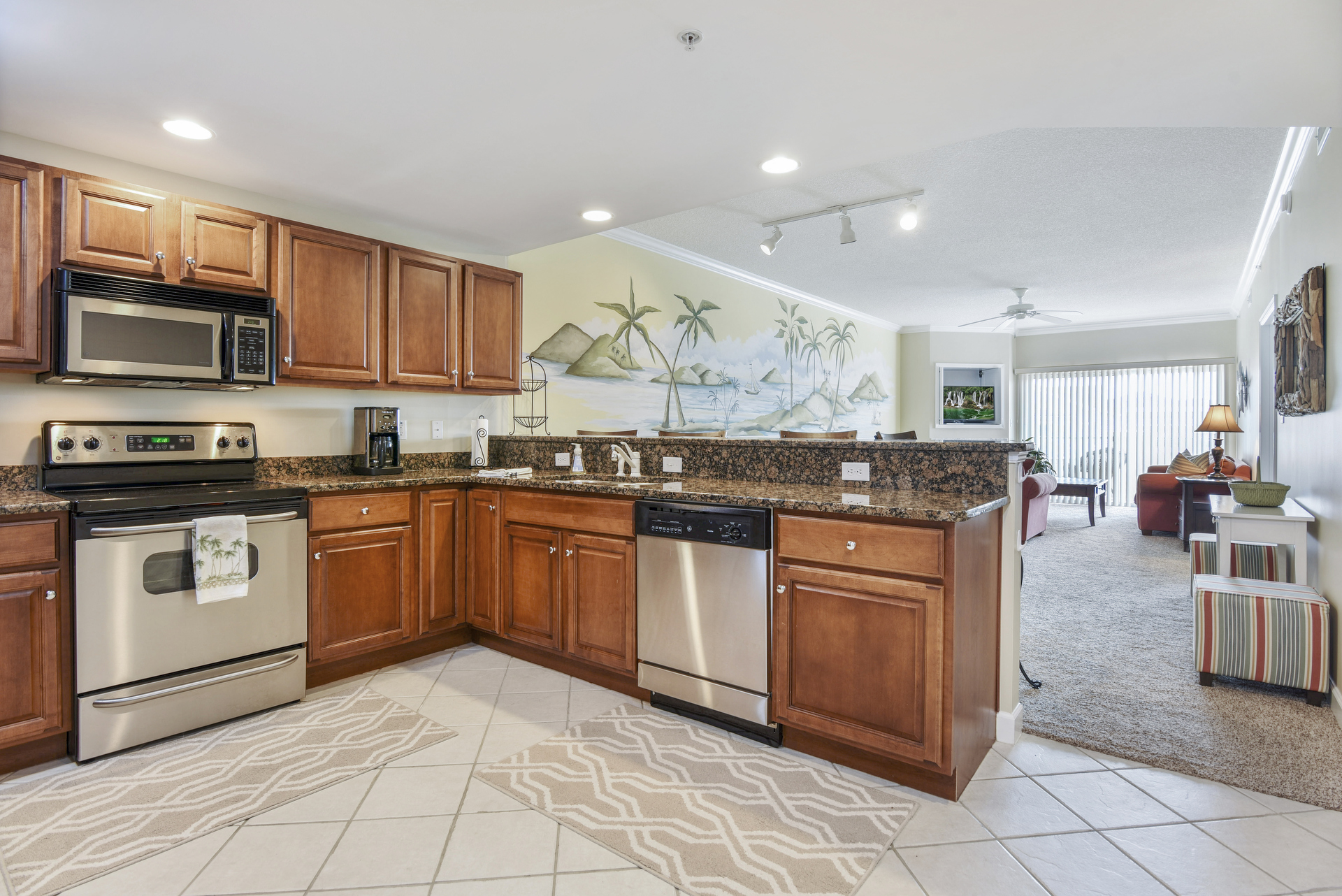 Gourmet Kitchen with Granite, Custom Tile, & Stainless Steel Appliances.