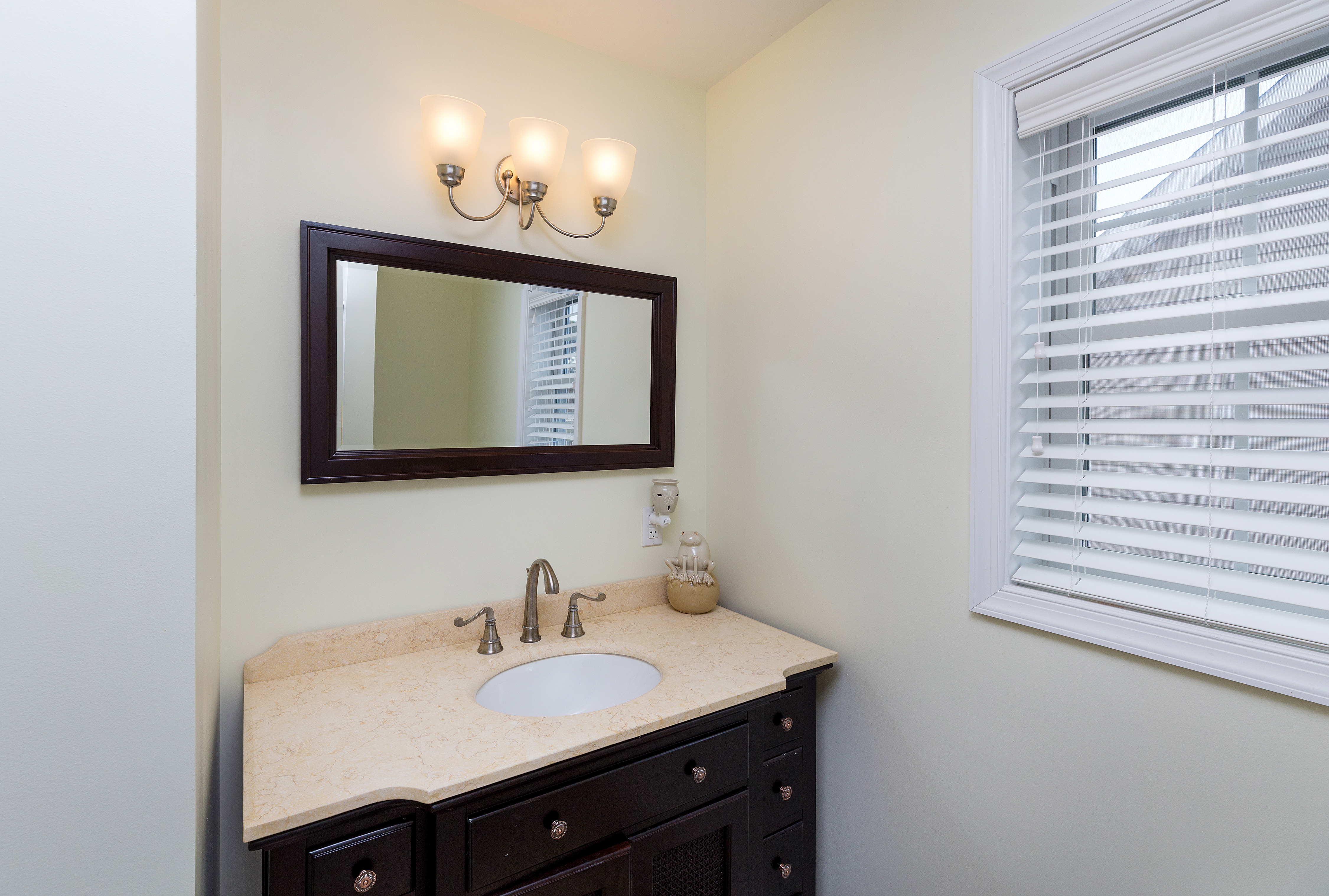 A Full Bath with Tub/Shower Combo is shared between Bedrooms 3 & 4.