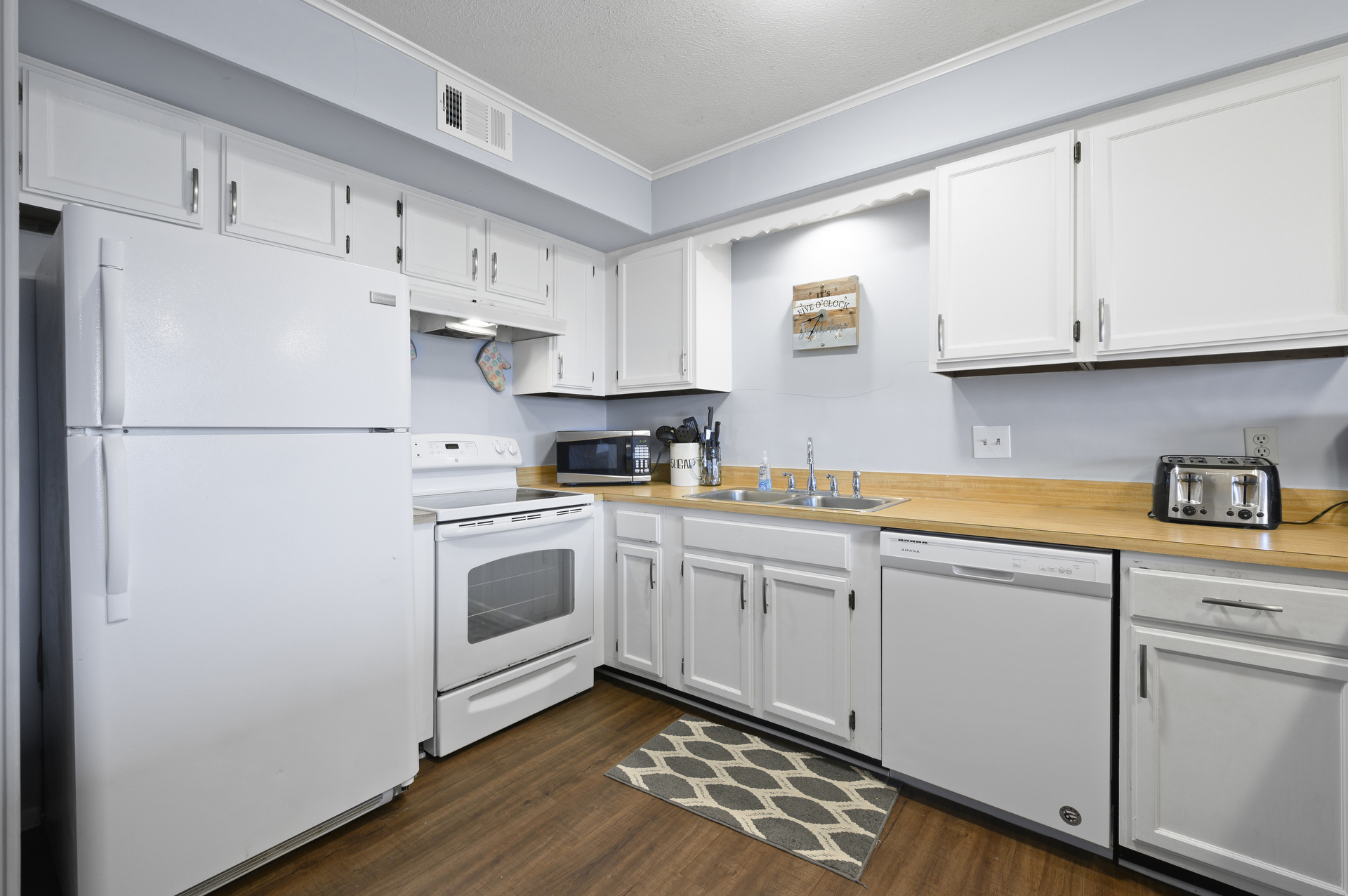 Gorgeous Rustic Floors & Beachy White Cabinetry.