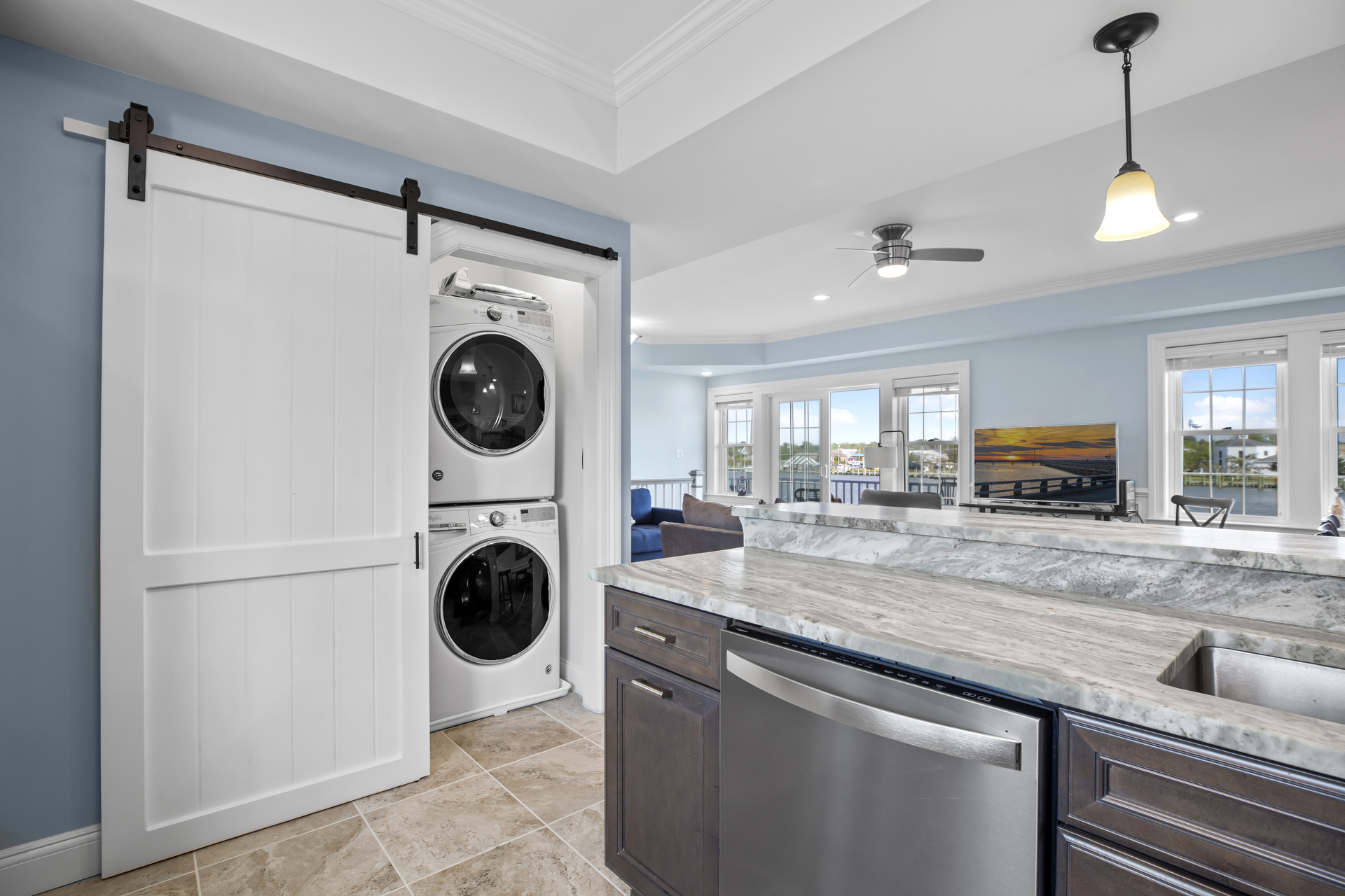 Full Size Washer and Dryer tucked behind charming Barn Doors.