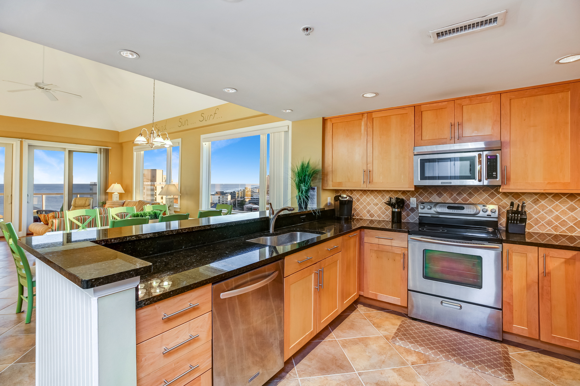 Warm Wood Cabinets & Gleaming Granite are quite luxurious.
