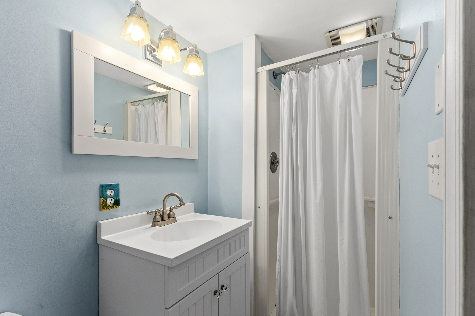 And a convenient Full Bath with Walk-in Shower,