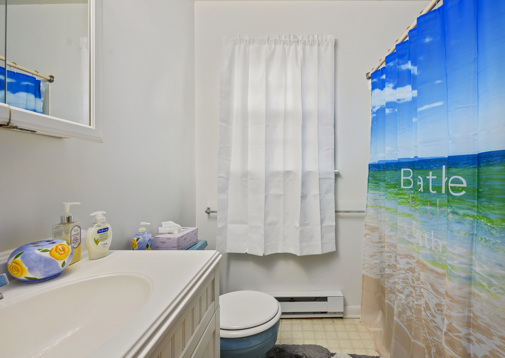 Full Bath is bright and beachy.