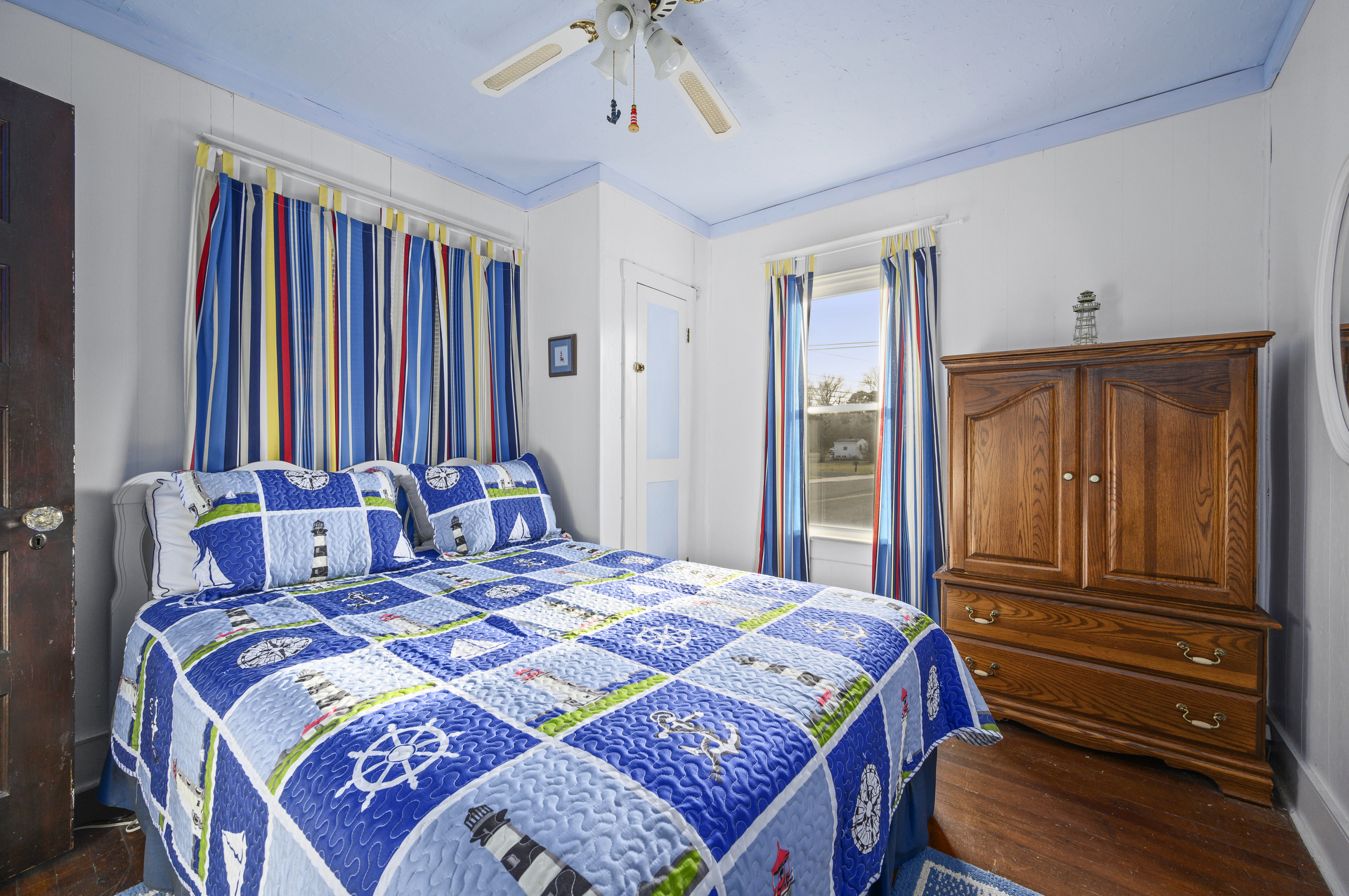 Just off Living Room is Bedroom 1 with Queen Bed.