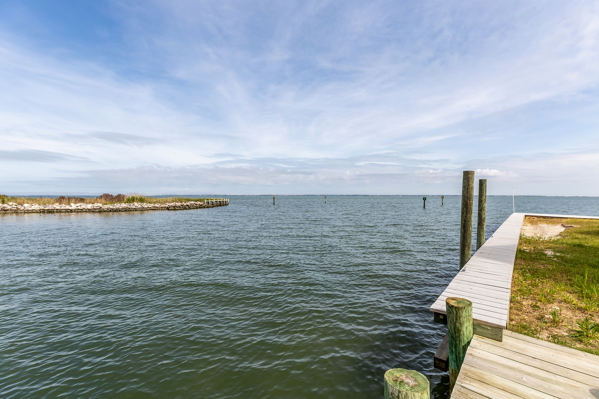 Located at the Point with Canal and open Bay Views.