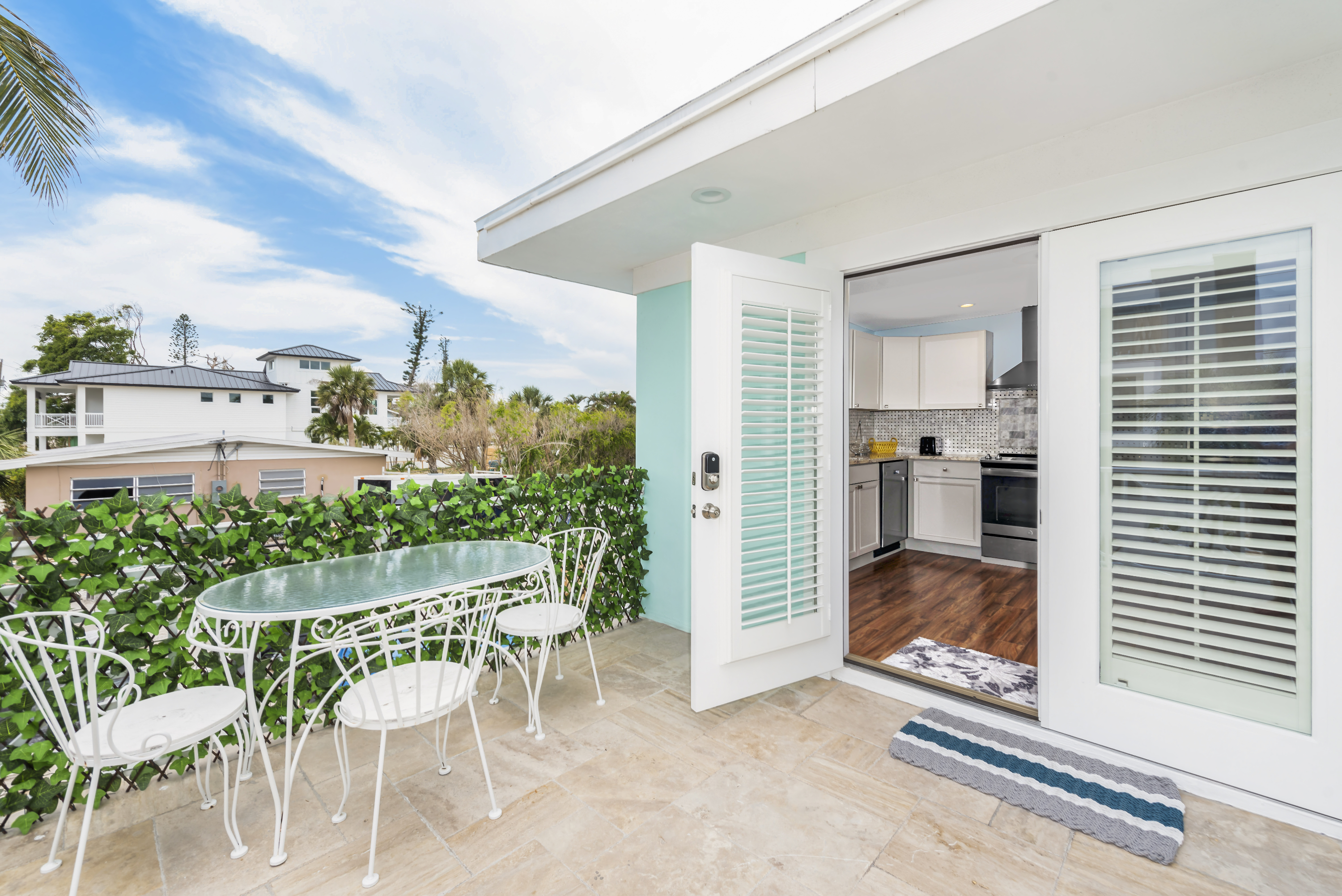 Dining on Front Terrace and Main Entry Door