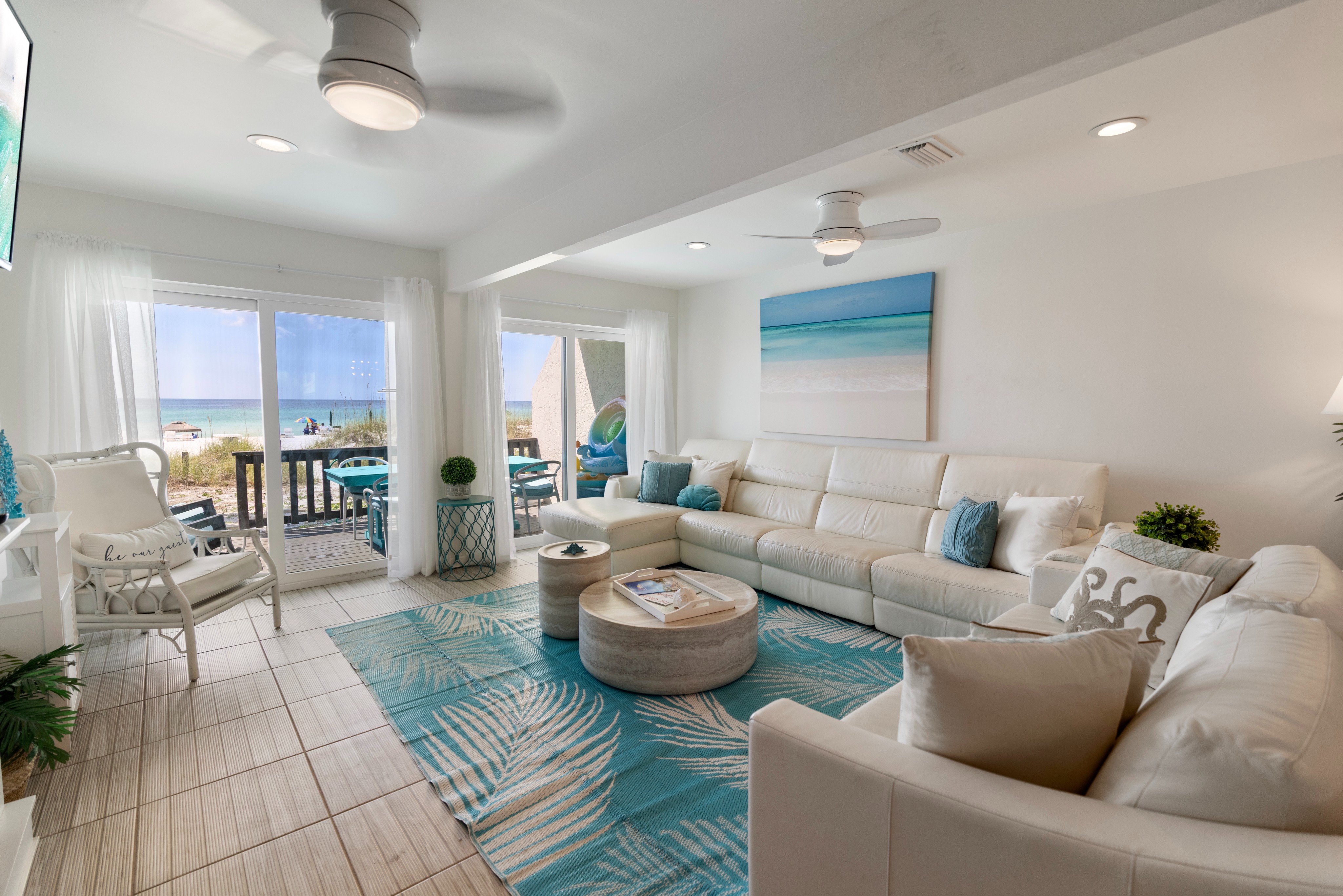Unwind in your bright, coastal living space where ocean breezes and beach views await just steps from your door. The airy design invites you to relax on plush seating while the sound of waves sets the perfect vacation mood.