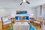 The stylish living room at Royal Kahana 213 features plush seating and warm lighting for cozy evenings.