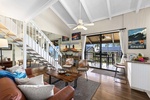 Vaulted ceilings, island-inspired décor, and seamless indoor-outdoor living create a bright and welcoming retreat overlooking the ocean.