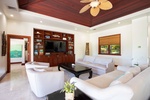 The expansive living area that opens directly to the lanai, a perfect spot for gathering and entertainment.