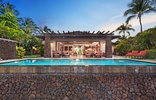 Your home away from home offers an infinity pool with exterior built lava rock wall.