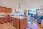 The kitchen at Kaanapali Shores 746 seamlessly connects to the living room, perfect for cooking and enjoying the view.