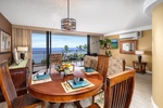 Indoor dining for four with sweeping coastal views.