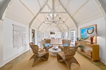 Stylish sitting area under high, vaulted ceilings—perfect for enjoying coffee and conversation.