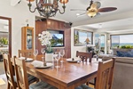 Dining area at Hale Oka Nunu with seating for six and ocean views.