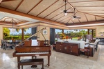 Grand piano and panoramic views in the great room—a luxury retreat infused with island sophistication.
