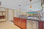 Spacious kitchen opens to the bright living area at Honua Kai Konea 204.