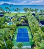 Kailua Shores Estate - USTA approved private Tennis Court nestled within tropical foliage for an exclusive playing experience.