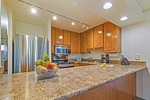 Kaanapali Shores 544’s kitchen boasts stainless steel appliances and spacious counters for meal prep.