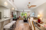 Open-concept living at its finest—dine, relax, and entertain with seamless flow from kitchen to couch to lanai.