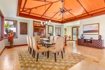 Gather for dinner under soaring ceilings and tasteful island-inspired design.