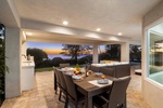 Dine al fresco at the lanai table while enjoying panoramic twilight views and tropical breezes.